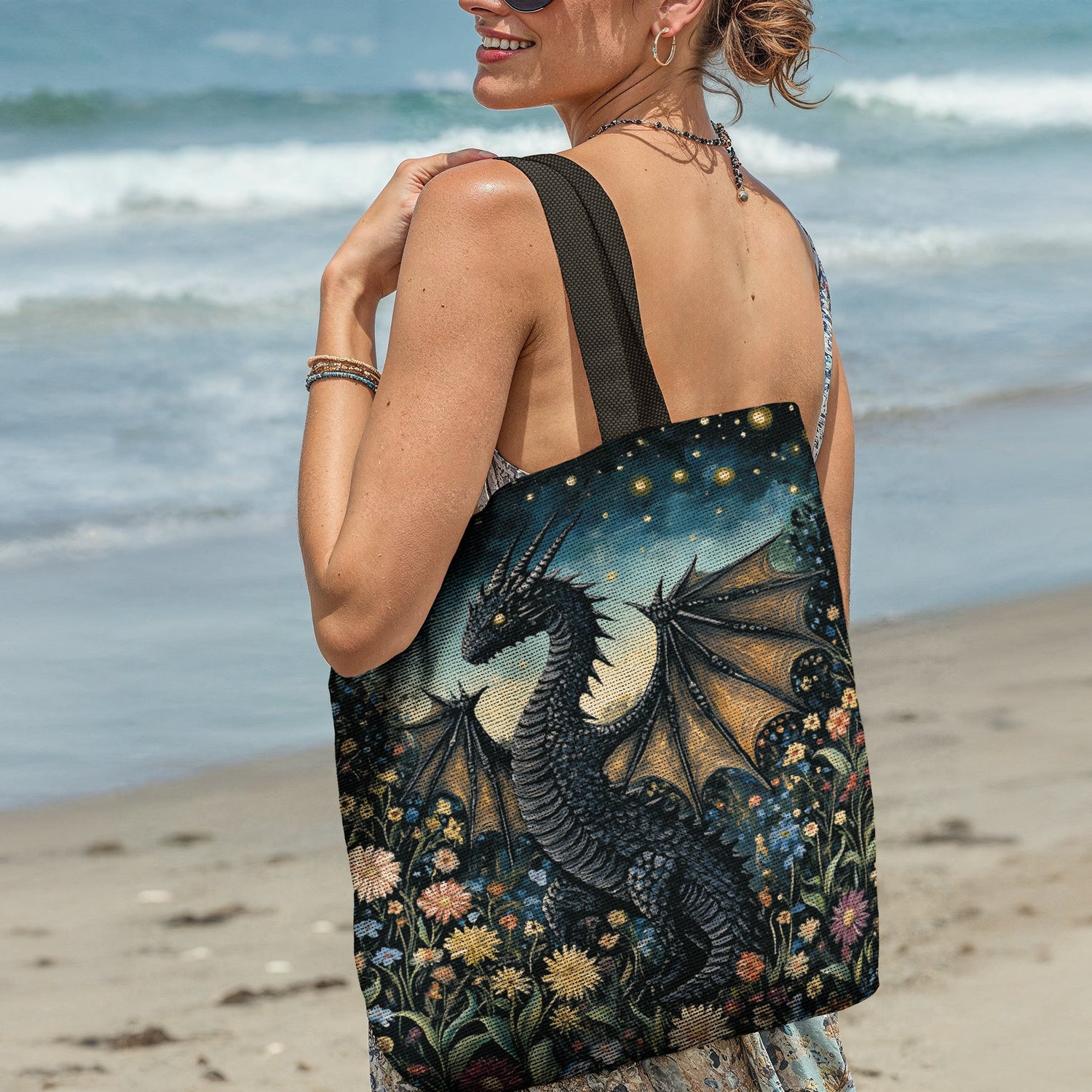 Woman at beach holding a fantasy dragon woven tote bag