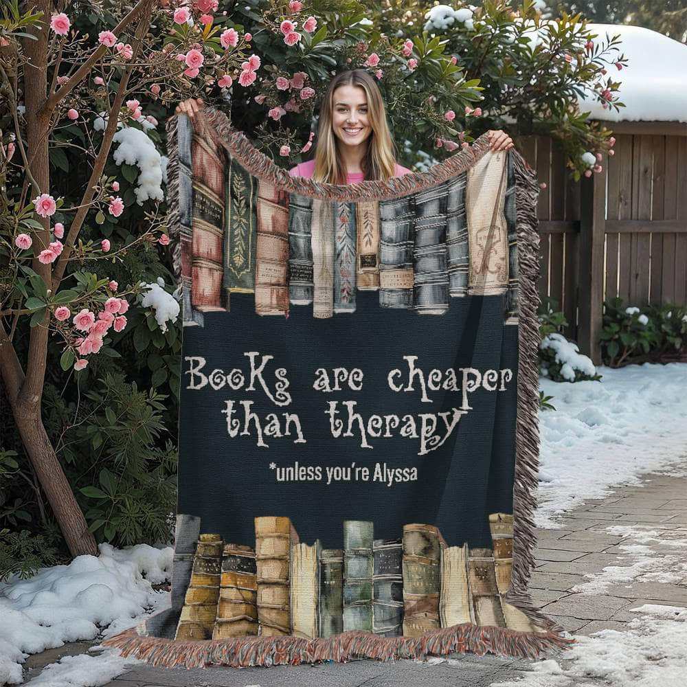 Personalized "Books Are Cheaper Than Therapy" Woven Blanket held up by girl – Gift for Introverted Readers - Offbeat Opulence